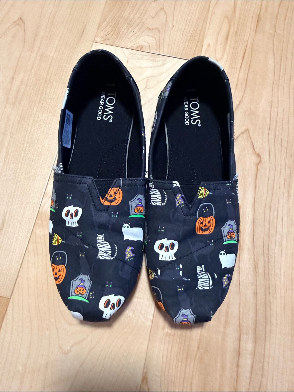 TOMS women’s Black Halloween Print Alpargata Slip-Ons New without tags